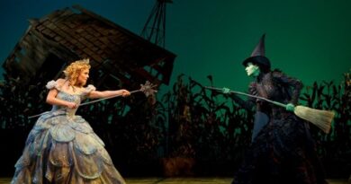 Elphaba and Glinda facing off during Wicked.