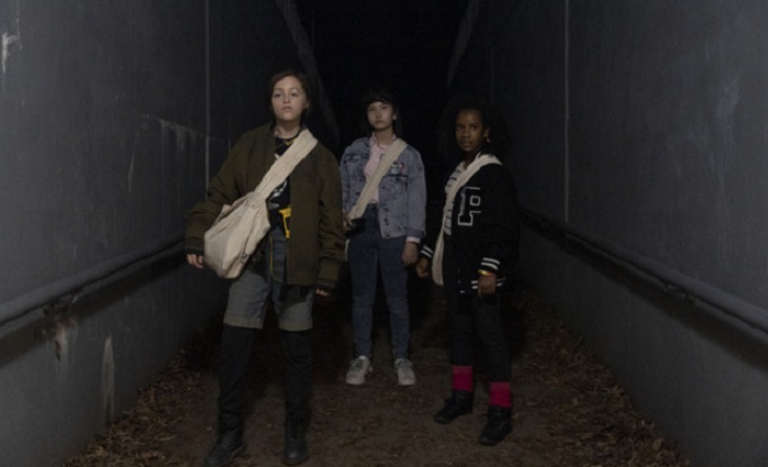 Behind the scenes photography for Paper Girls. Sofia Rosinsky as Mac Coyle, Riley Lai Nelet as Erin Tieng, and Sofia Camryn Jones as Tiffany Quilkin in Paper Girls. Photo by Anjali Pinto. Courtesy of Amazon Studios.